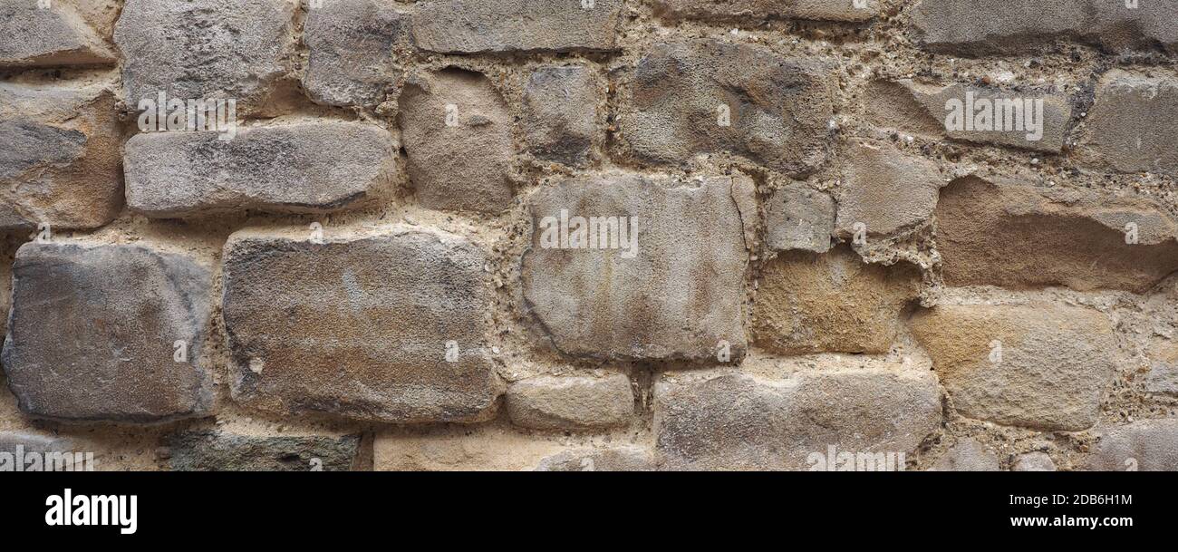 grey stone wall useful as a background Stock Photo - Alamy