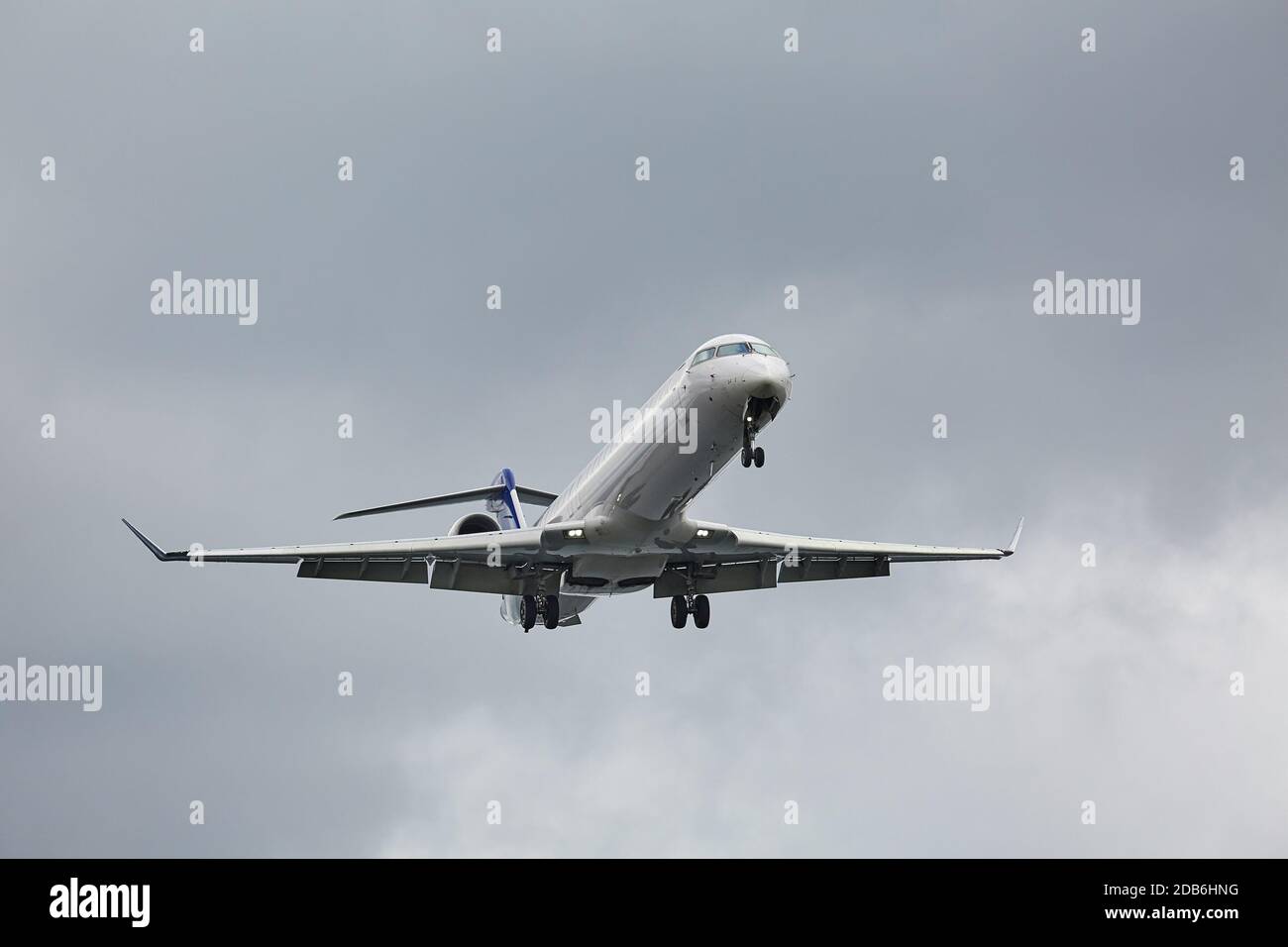 Plane approaching with landing lights Stock Photo - Alamy