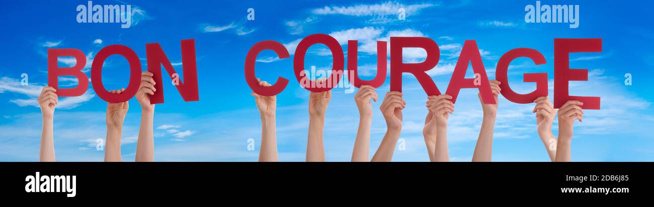 People Hands Holding Word Bon Courage Means You Can Do It Blue Sky Stock Photo Alamy People Hands Holding Word Bon Courage Means You Can Do It Blue Sky Stock Photo Alamy
