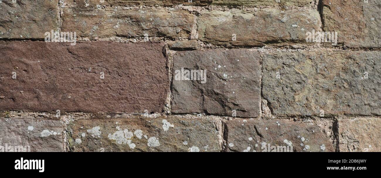 wide grey stone wall useful as a background Stock Photo - Alamy