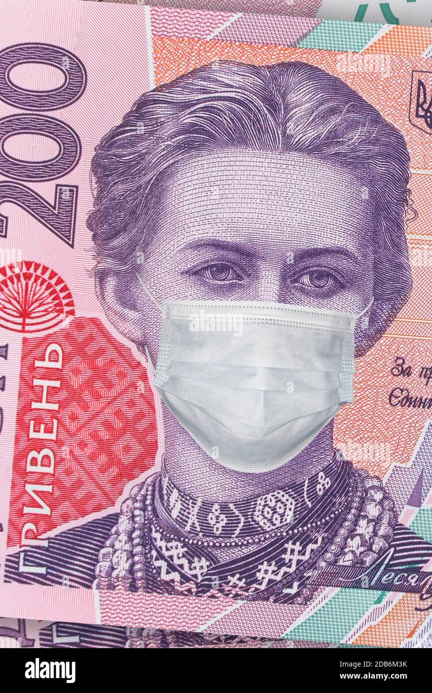 200 hryvnia banknote with Lesya Ukrainka in a medical mask, vertical. Economic crisis has affected Ukraine. Ukrainian money, coronavirus concept, mont Stock Photo