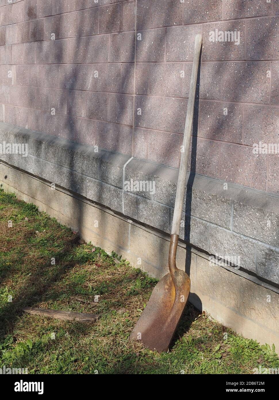 This shovel is leaning against the wall. Stock Photo