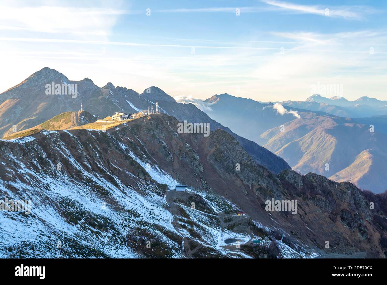 Top of snowy high mountain and clouds in sunny day Stock Photo - Alamy