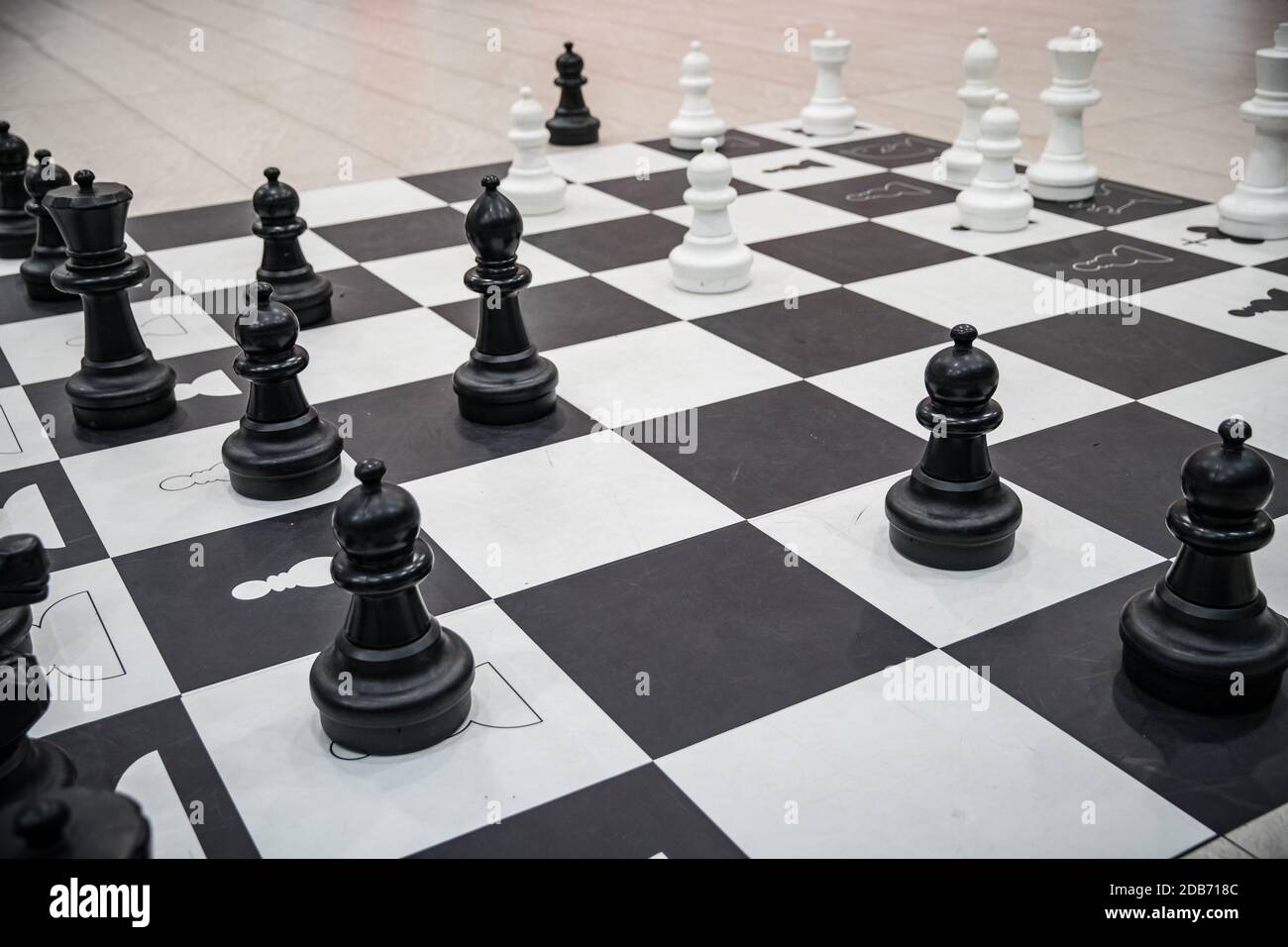 mannequins from chess game on black and white squares. Stock Photo