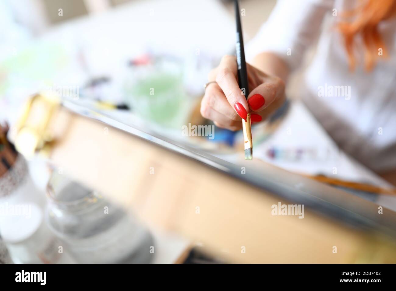 Female hand with red nails Stock Photo