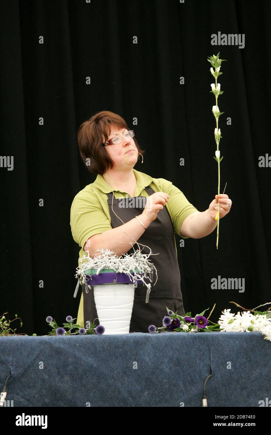 Scotland Ayrshire Ayr Flower Show. Woman showing how to create floral
