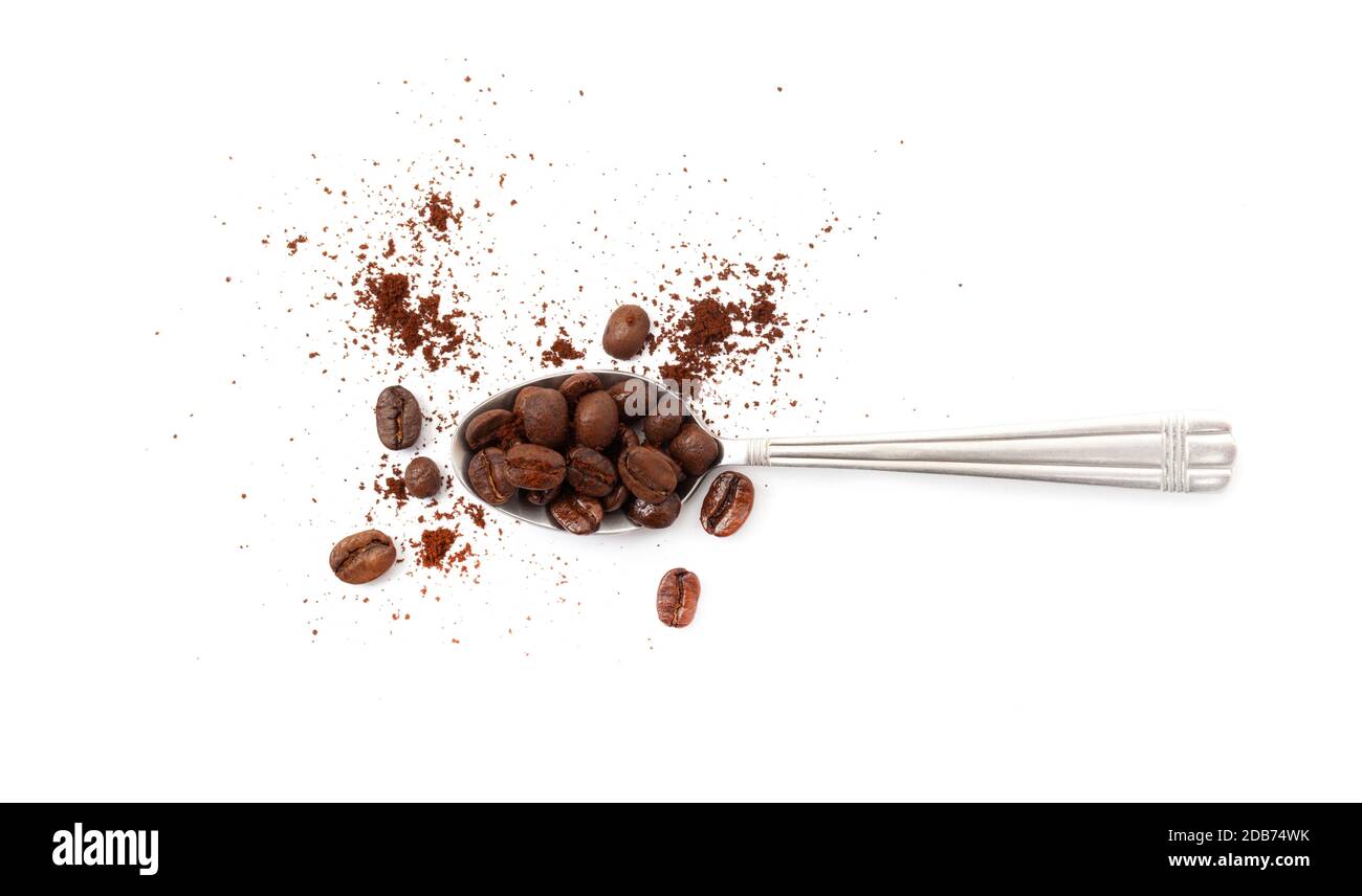 Spoon with coffee beans isolated on white background Stock Photo - Alamy