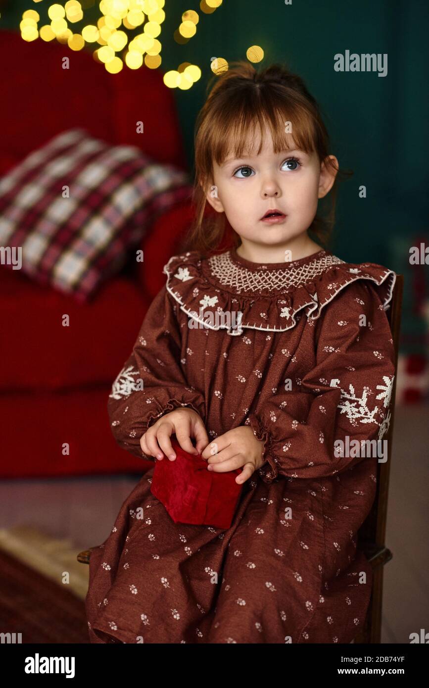 Girl sitting on stool hi-res stock photography and images - Alamy