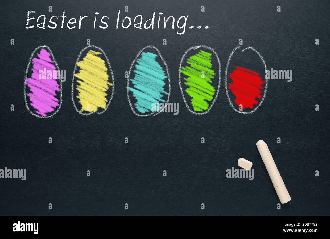 Hand drawn Easter eggs on a chalkboard with the words Easter is loading, Happy Easter background Stock Photo