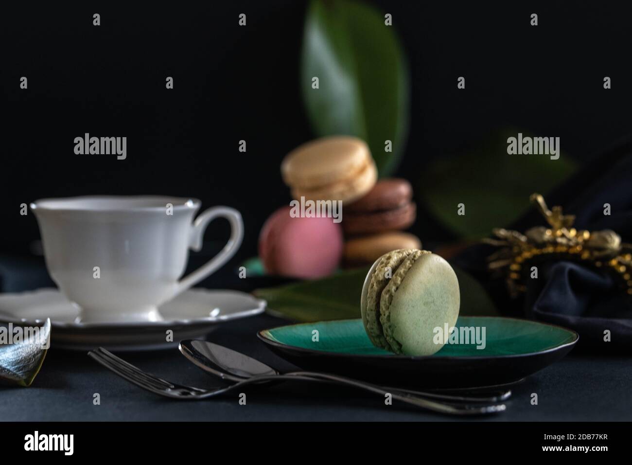 Closeup of macarones with a cup of coffee. Stock Photo