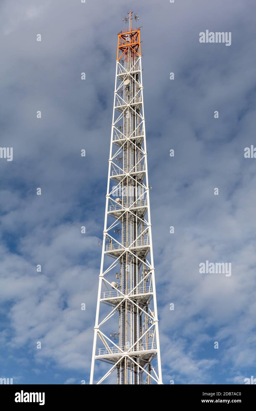 radio mast against cloudy sky Stock Photo