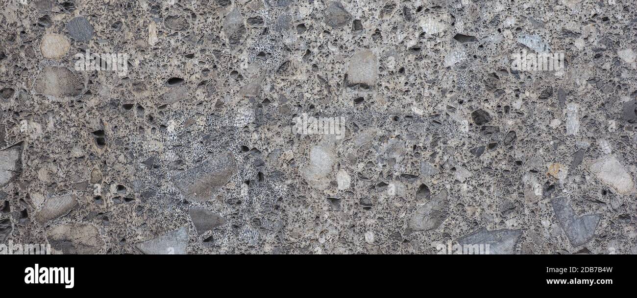 wide grey stone wall useful as a background Stock Photo - Alamy