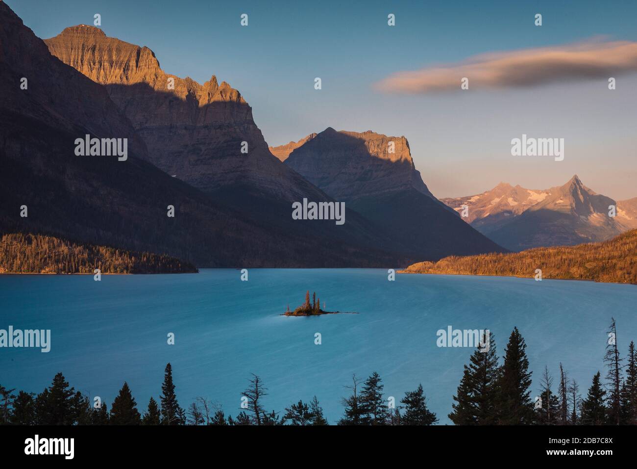 Scenic view of blue lake with mountain range in background, Browning, Montana, USA Stock Photo