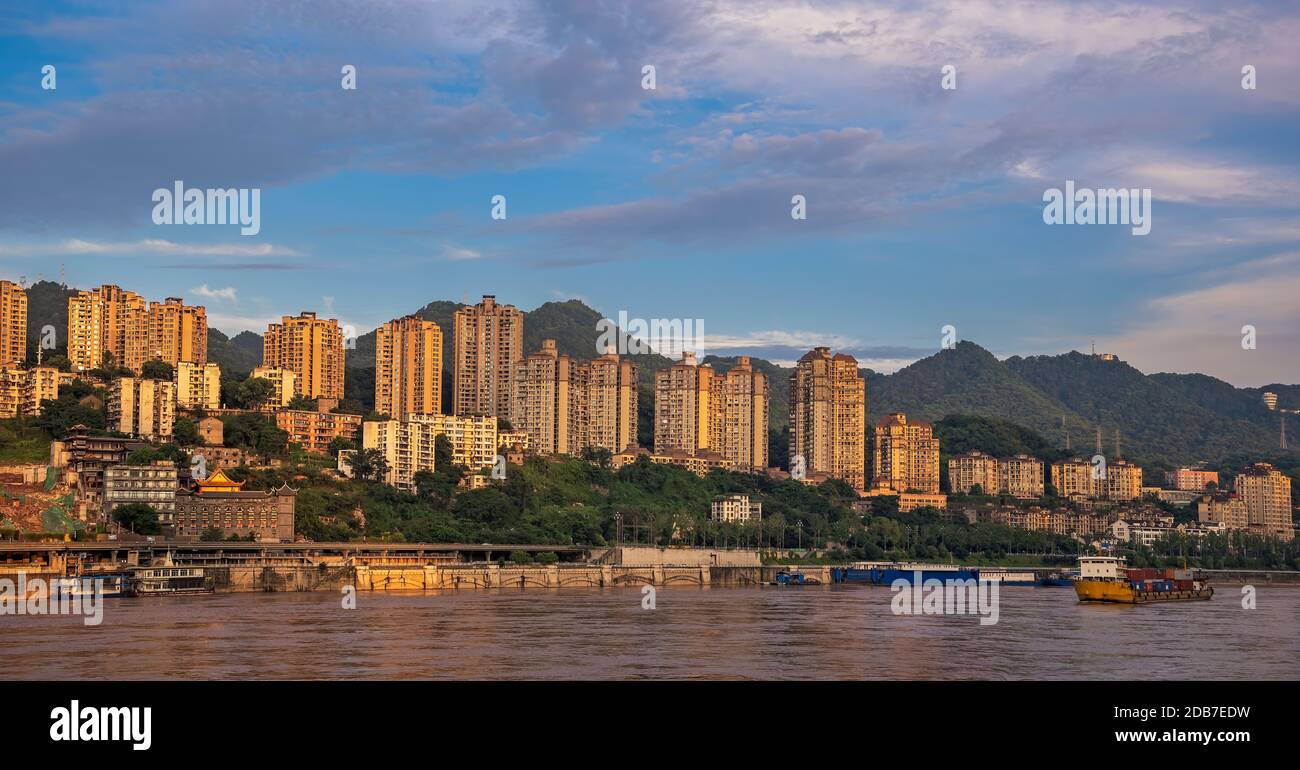 Chongqing, China - August 2019 : Panoramic view of the highrise residential and commercial buildings on the shore of Yangtze river in Chongqing city Stock Photo