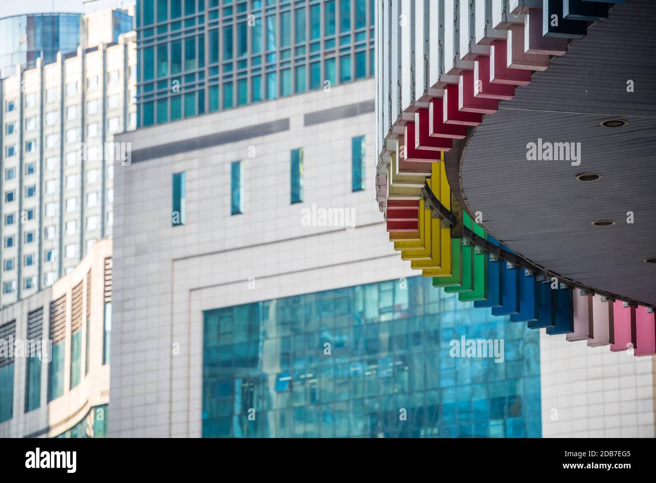 Chongqing, China - August 2019 : Exterior detail of the rainbow coloured modern commercial and business building in the Jiefangbei district in the dow Stock Photo