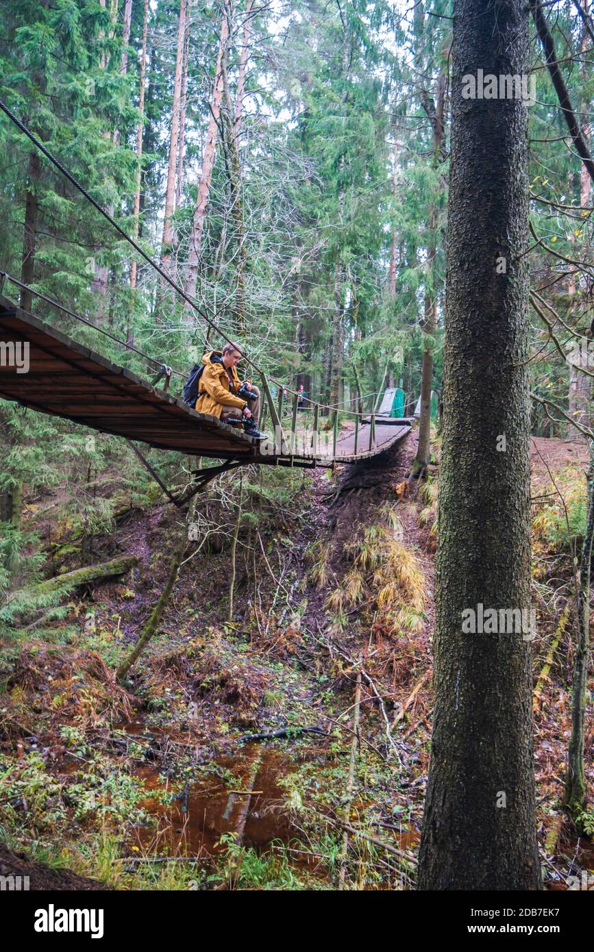 Man walking suspension bridge hi-res stock photography and images - Alamy