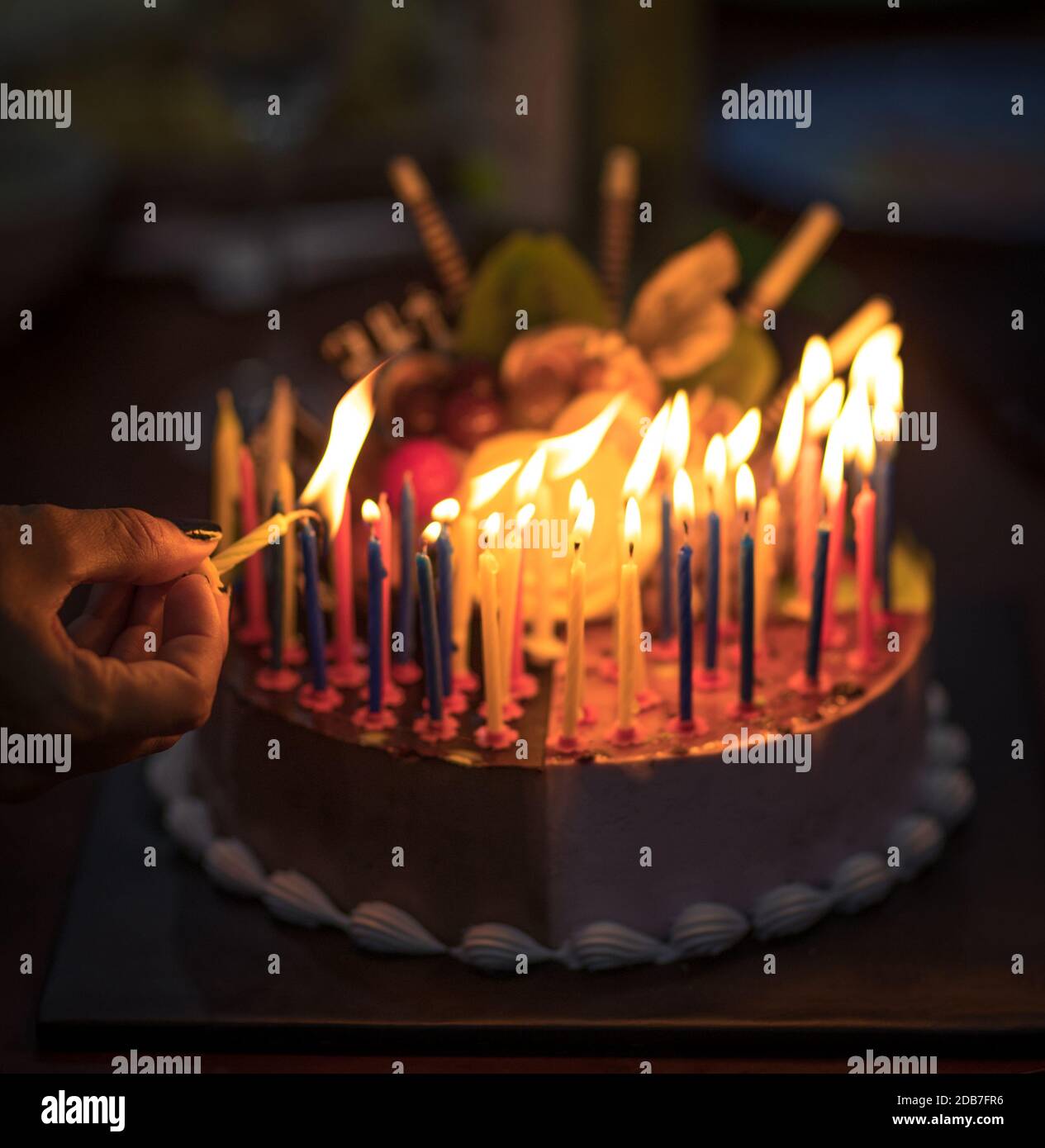 Birthday cake with candles in dark Stock Photo - Alamy