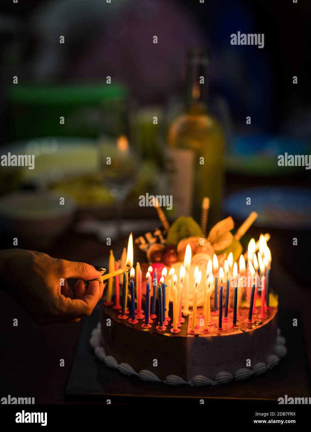 Birthday cake with candles in dark Stock Photo