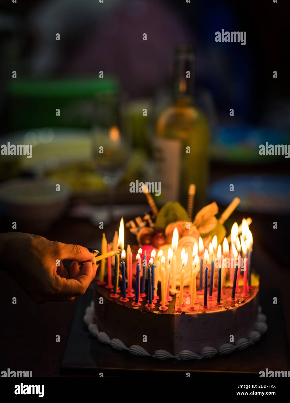Birthday cake with candles in dark Stock Photo - Alamy