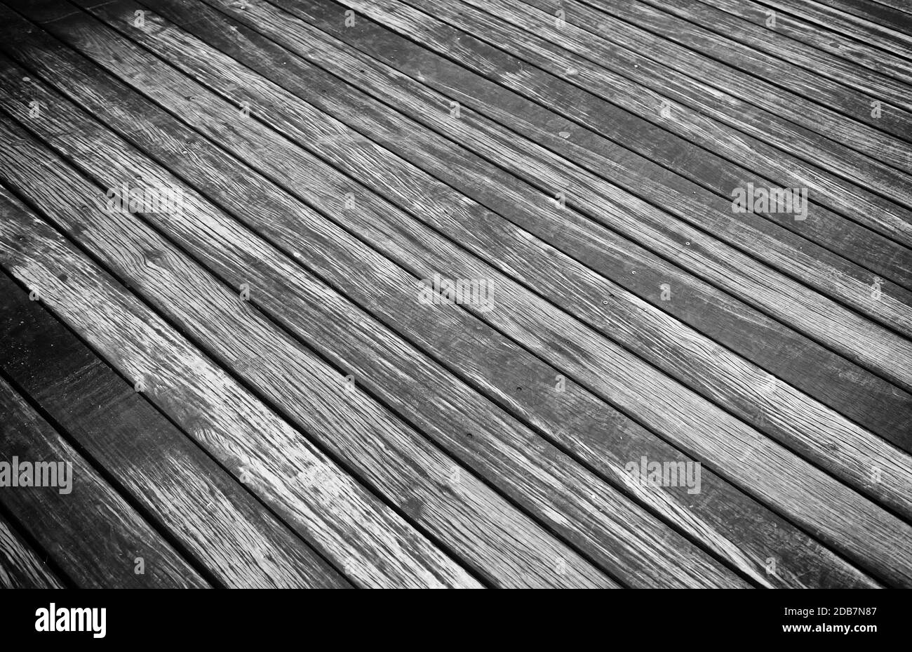 Old wet wood, detail of a wood siding in the city, pedestrian walkway