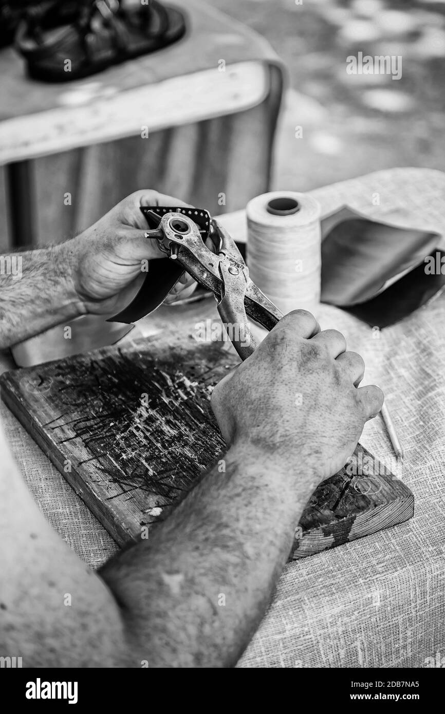 Man working with leather, detail of a person working with your hands Stock Photo