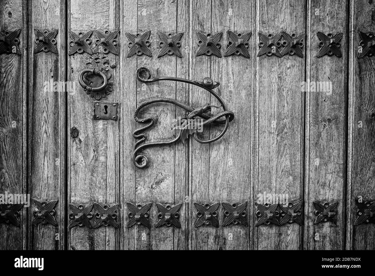 Old door handle, detail of an ancient decorated handle in town, vintage, decoration Stock Photo