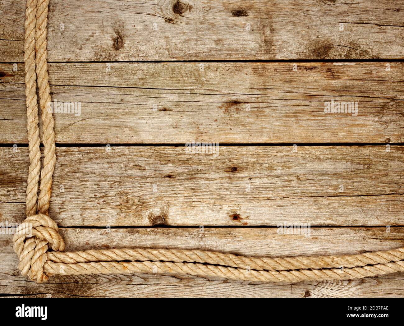 Background from old boards with rough rope Stock Photo - Alamy