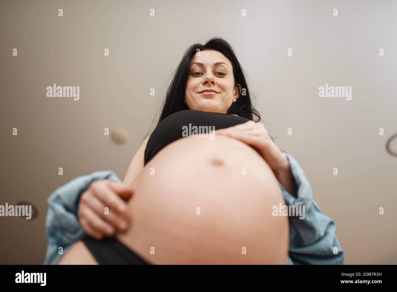 Premium Photo  Woman pregnant and thinking on future at window hope and  maternity love and hands on stomach mother healthy and care for baby  prenatal wellness and support in motherhood home