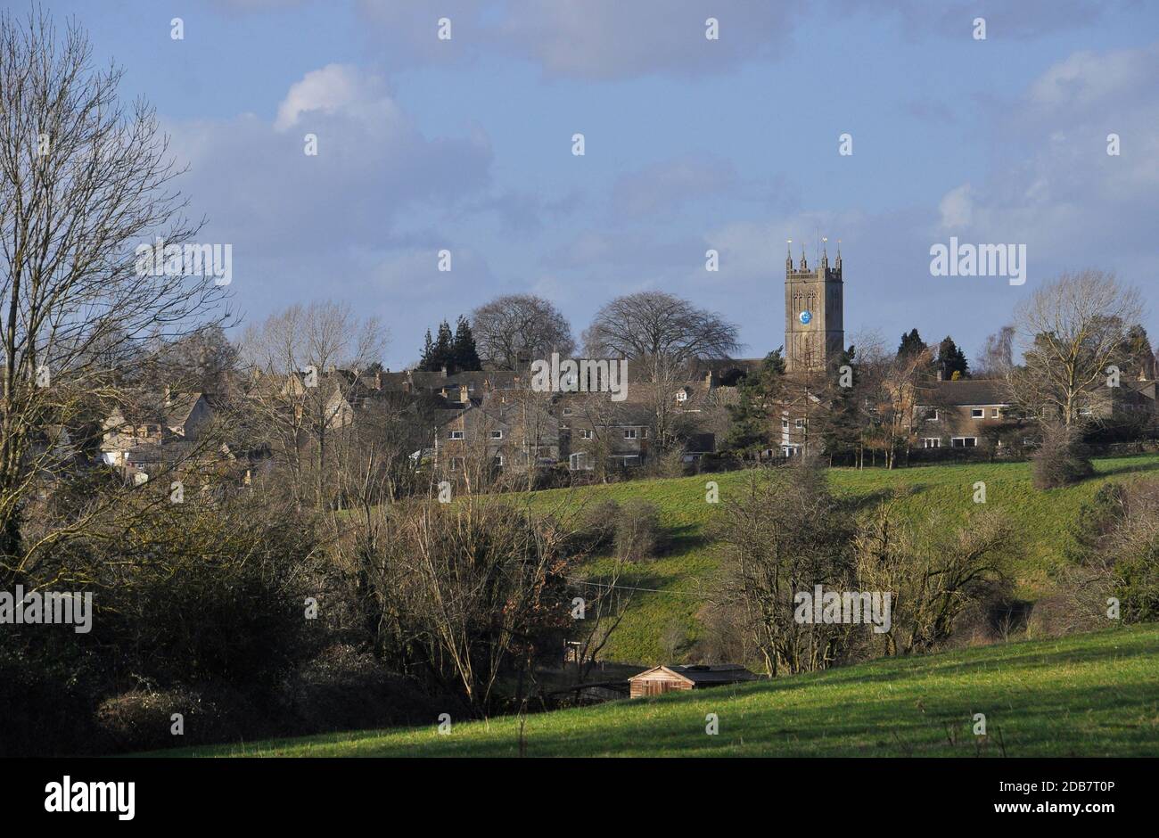 The Church of the Holy Cross in the hilltop Cotswold village of  Sherston bathed in the winter sunshine.Wiltshire.UK Stock Photo