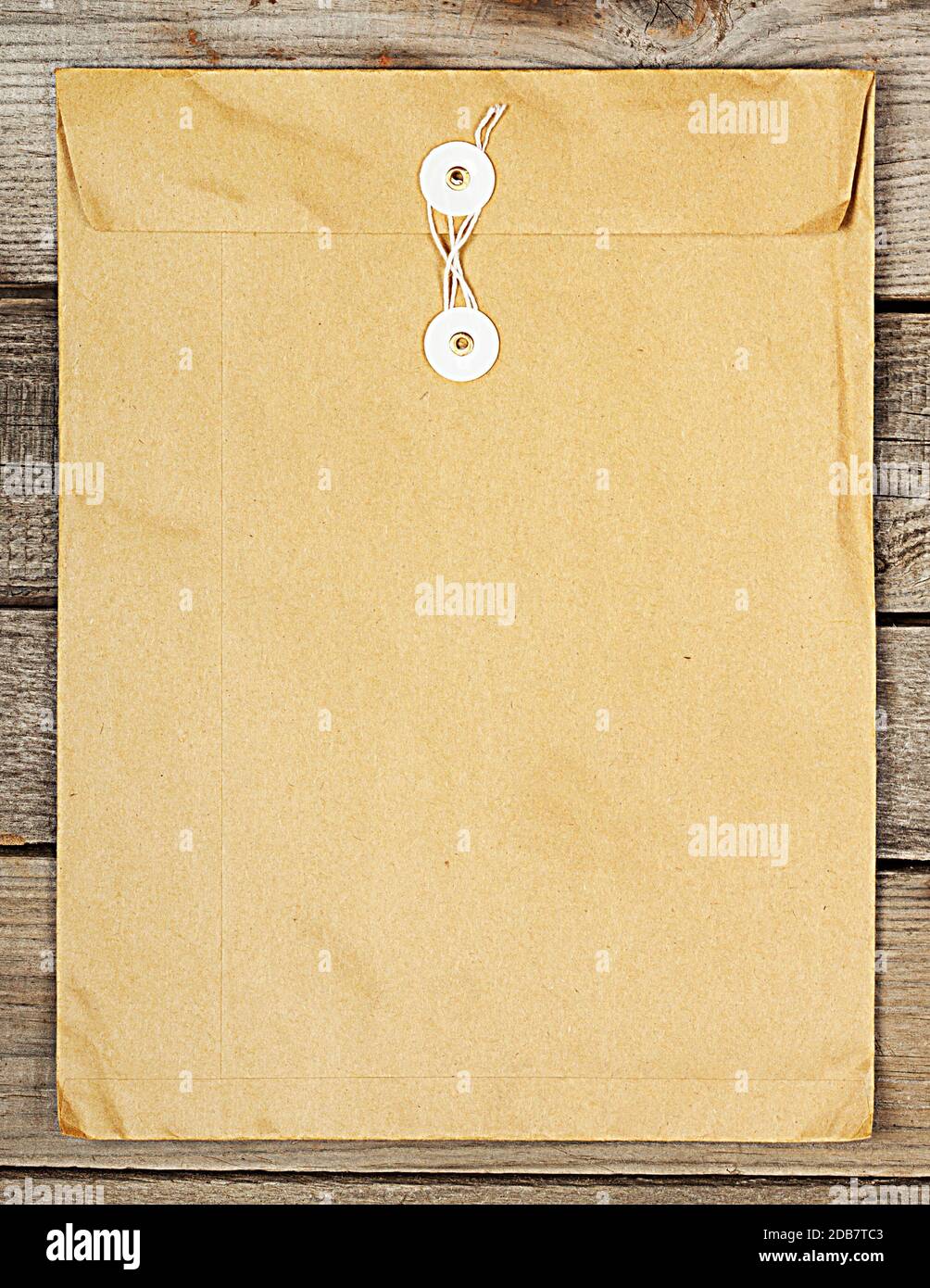 Paper envelope on the rough wooden background Stock Photo - Alamy
