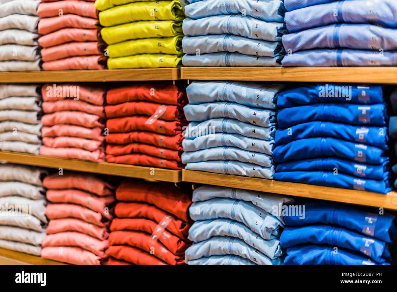 Clothing products on the shelf in a clothing store Stock Photo Alamy
