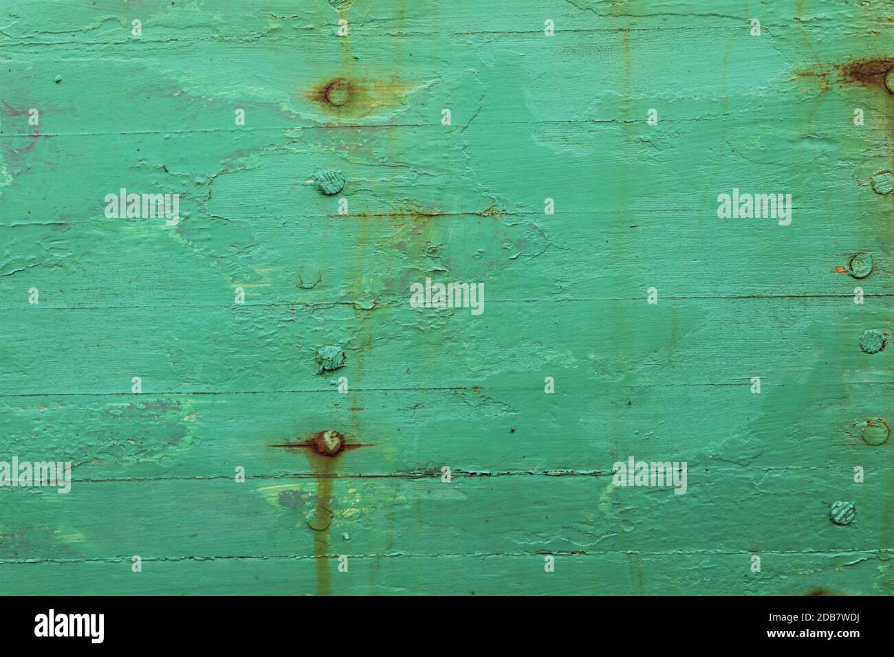 bright Green painted surface showing nails Stock Photo