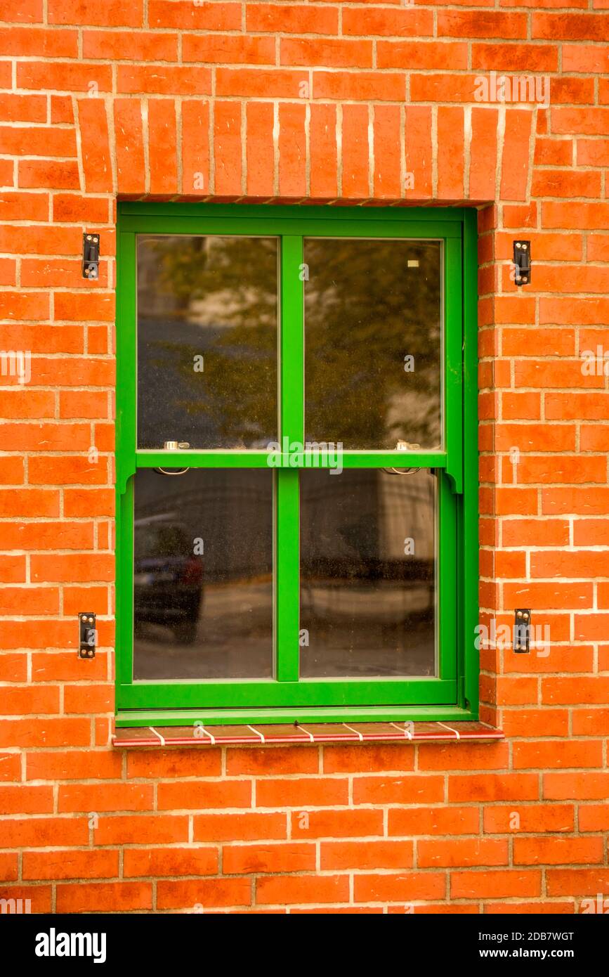 old green window in a red brick wall Stock Photo - Alamy