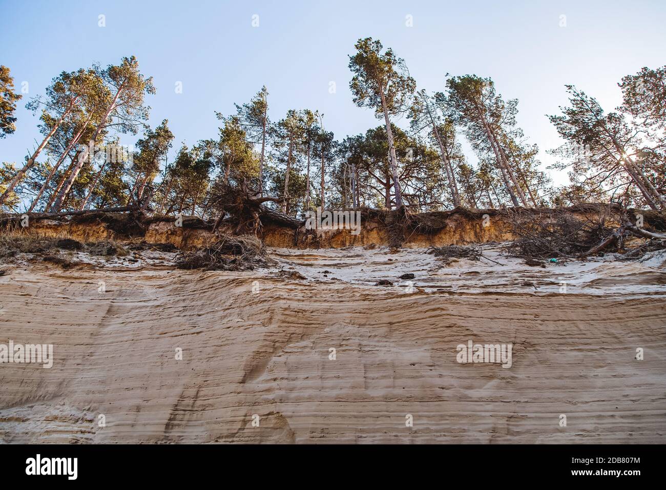 The sandy shore of the Baltic Sea washed out by storms, a threat to the environment Stock Photo
