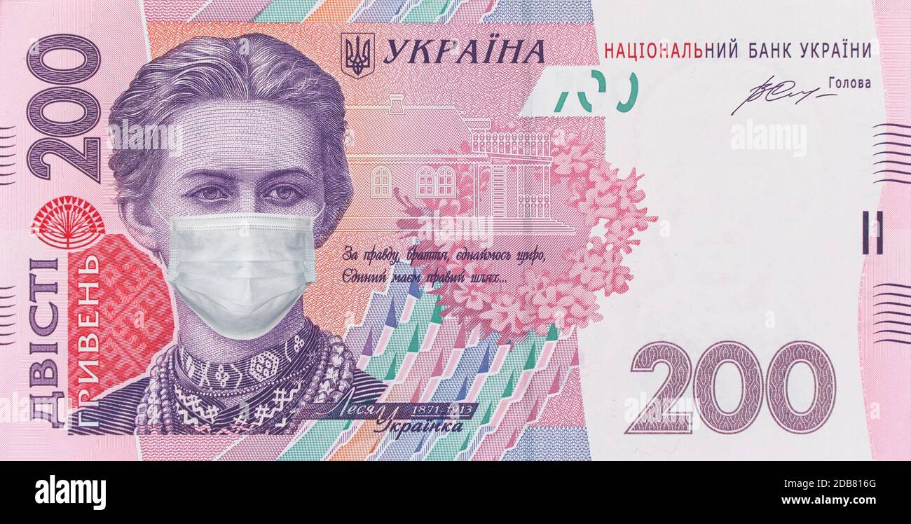 200 hryvnia banknote with Lesya Ukrainka in a medical mask, horizontal. Economic crisis has affected Ukraine. Ukrainian money, coronavirus concept, mo Stock Photo