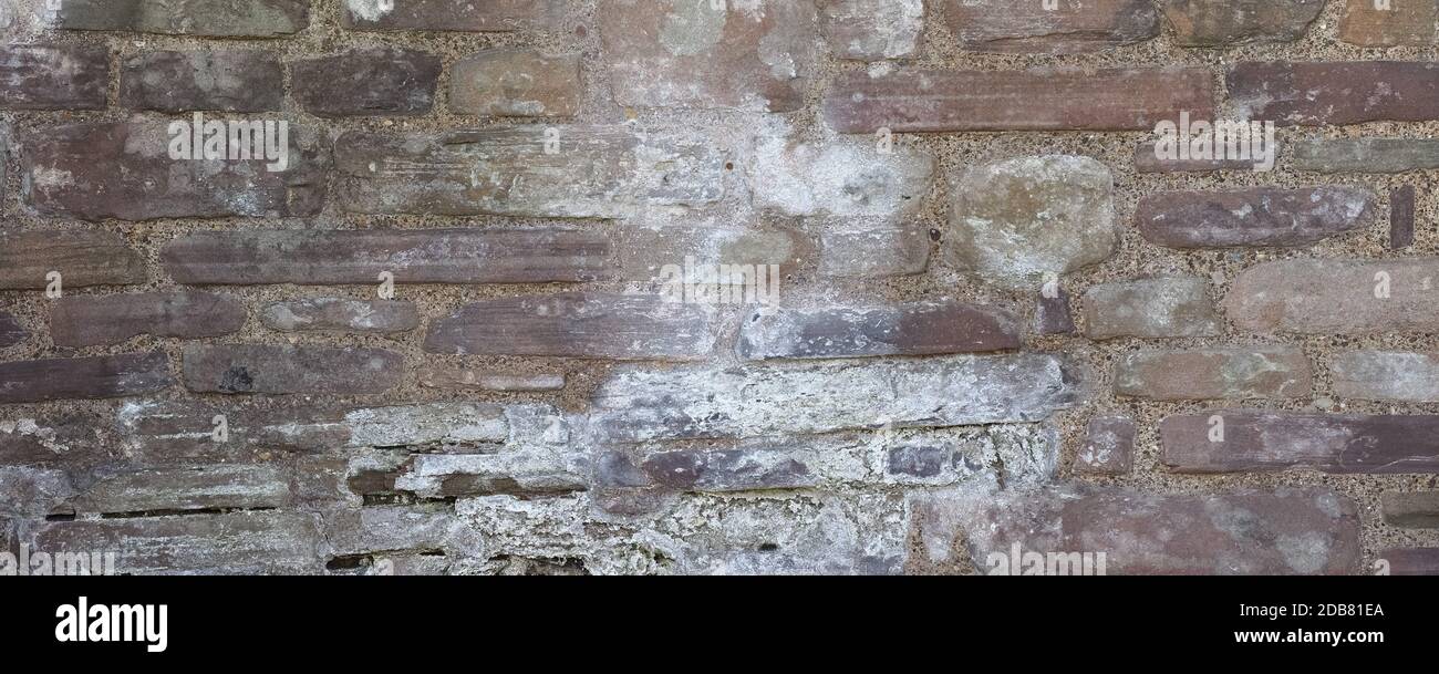 wide grey stone wall useful as a background Stock Photo - Alamy