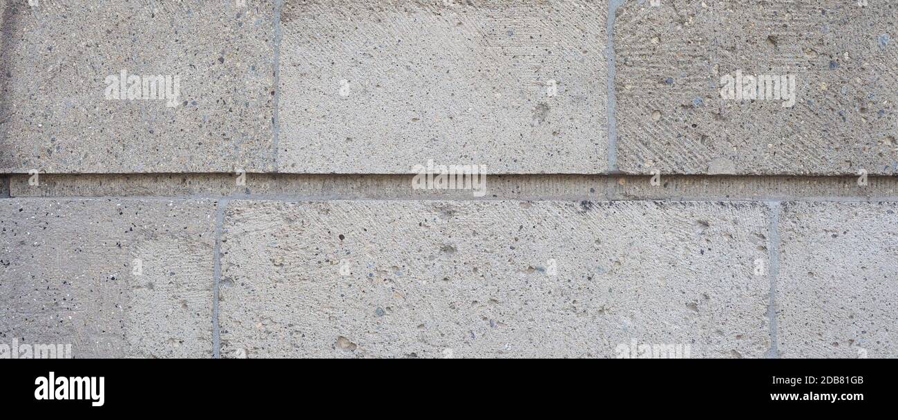 wide grey stone wall useful as a background Stock Photo - Alamy