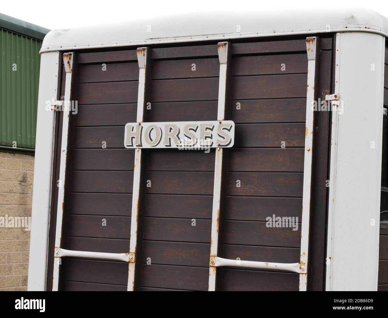 Horses sign on rear doors of horse box brown tail gate metal bars