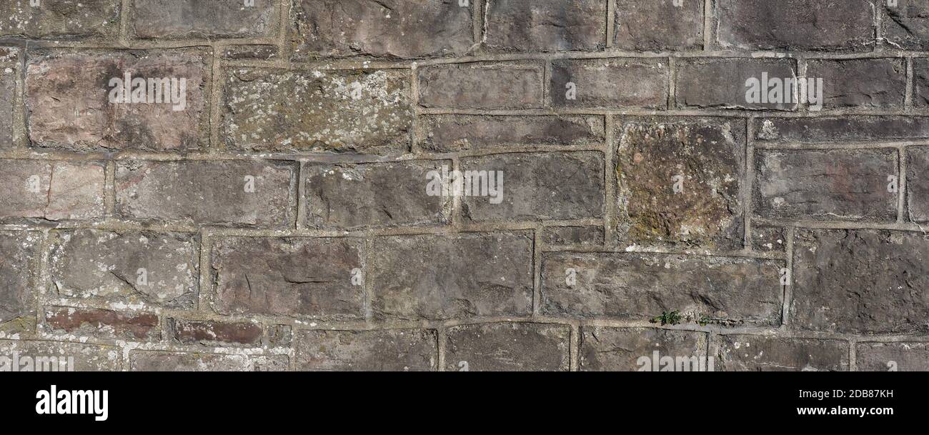 wide grey stone wall useful as a background Stock Photo - Alamy