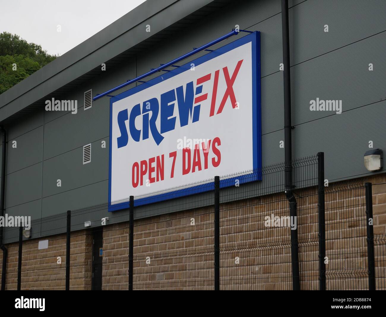 Screwfix open seven days sign white with blue and red letters blue