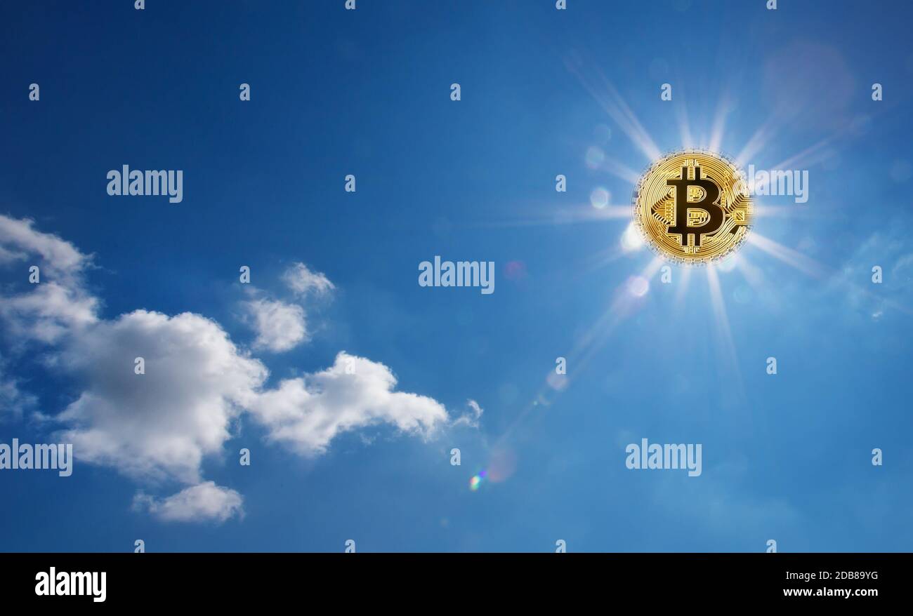 Golden bitcoin glowing in the blue sky instead of the sun. Bitcoin with  divergent rays in the sky. The concept of the onset of the bitcoin era  Stock Photo - Alamy