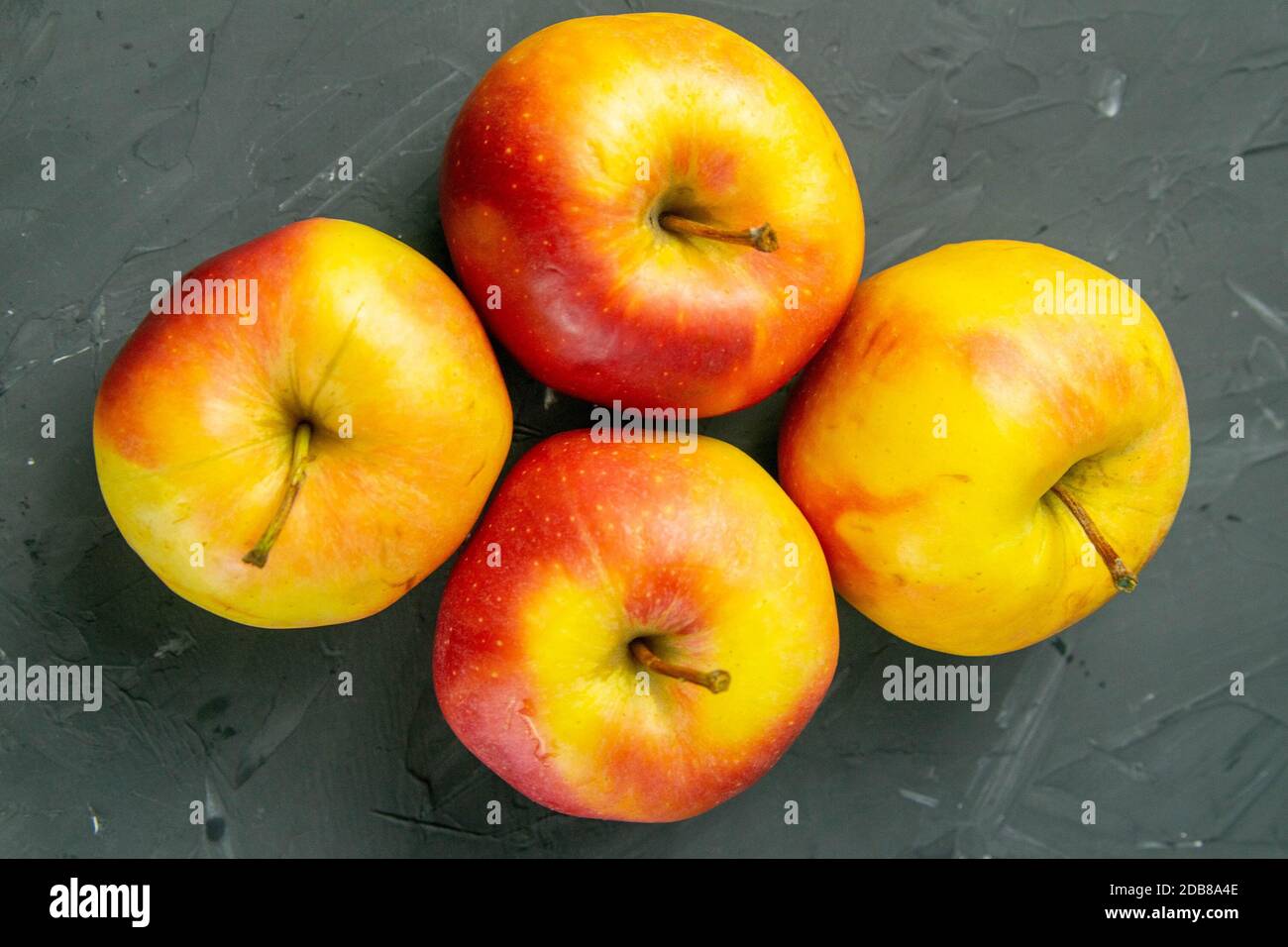 Apples on black stone table background. Front views Stock Photo