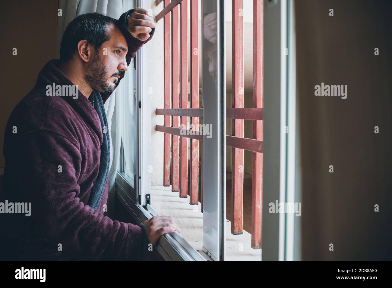 Man leaning out of window hi-res stock photography and images - Alamy