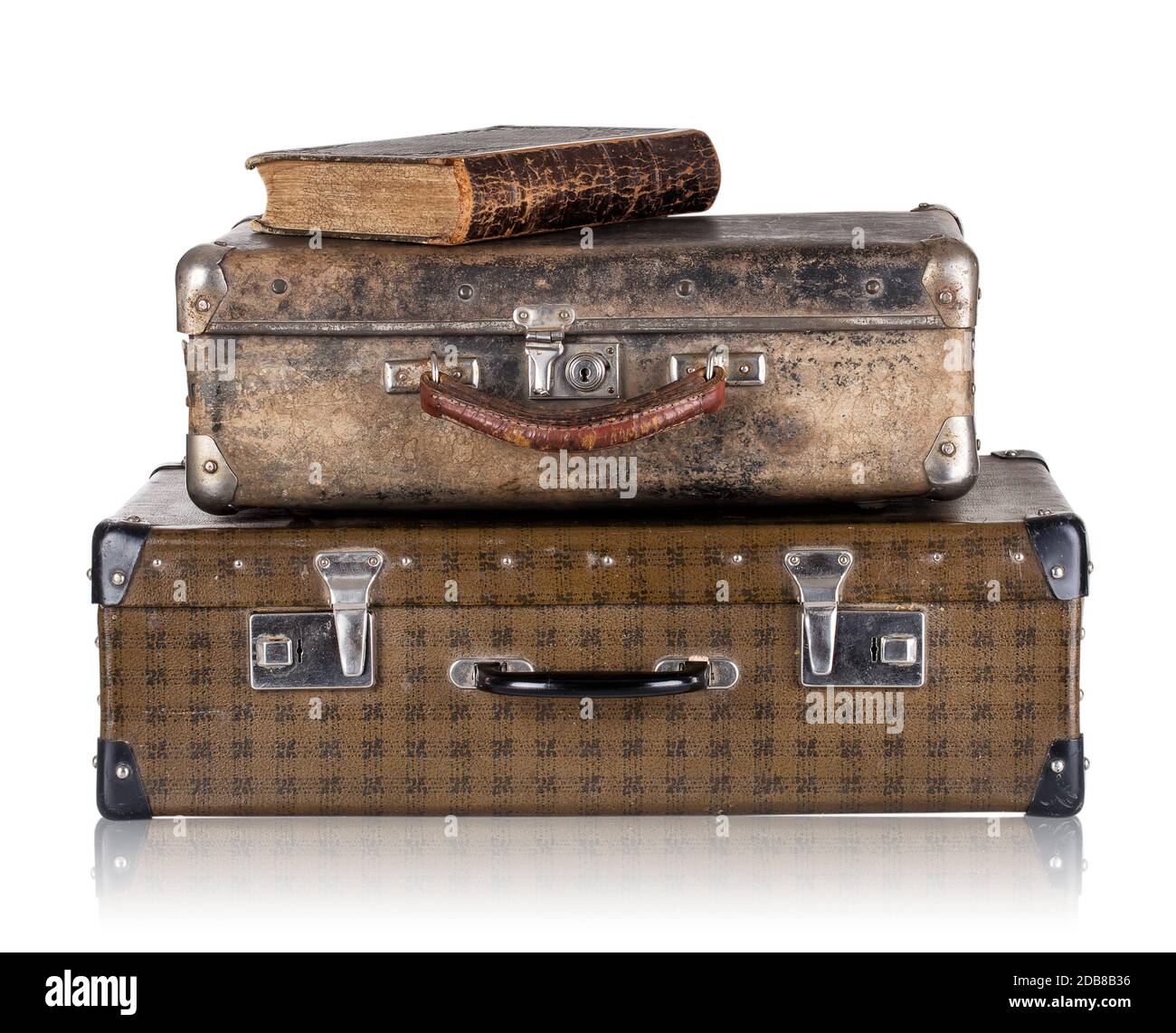 Vintage leather suitcases with book isolated on white background. The