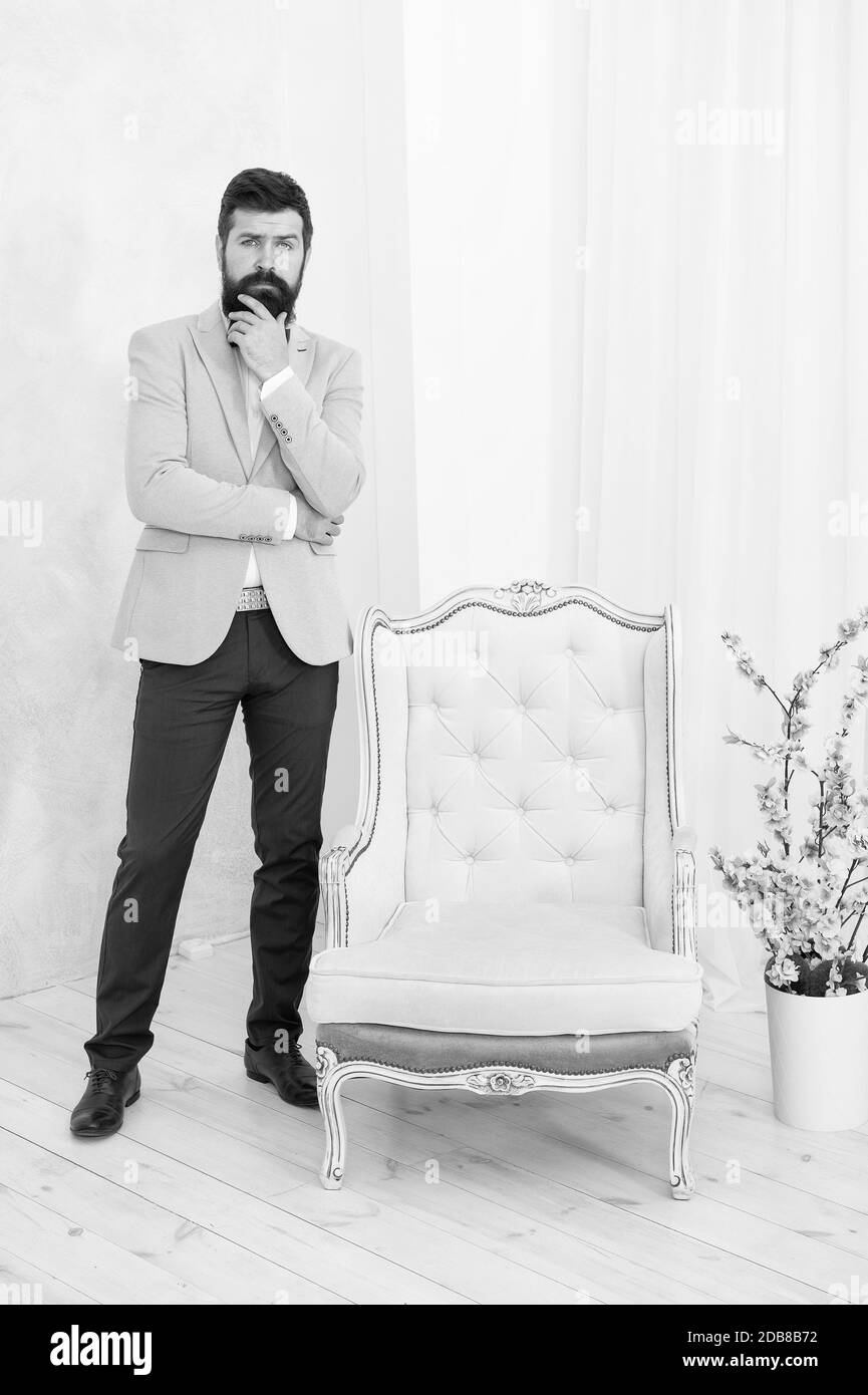 Have A Seat Luxury Furniture Shop Assistant Elegant Man In Formal Outfit Handsome Event Manager Tuxedo Man With Long Beard Perfect Brutal Male Fashion And Beauty Aesthetic Development Concept Stock Photo