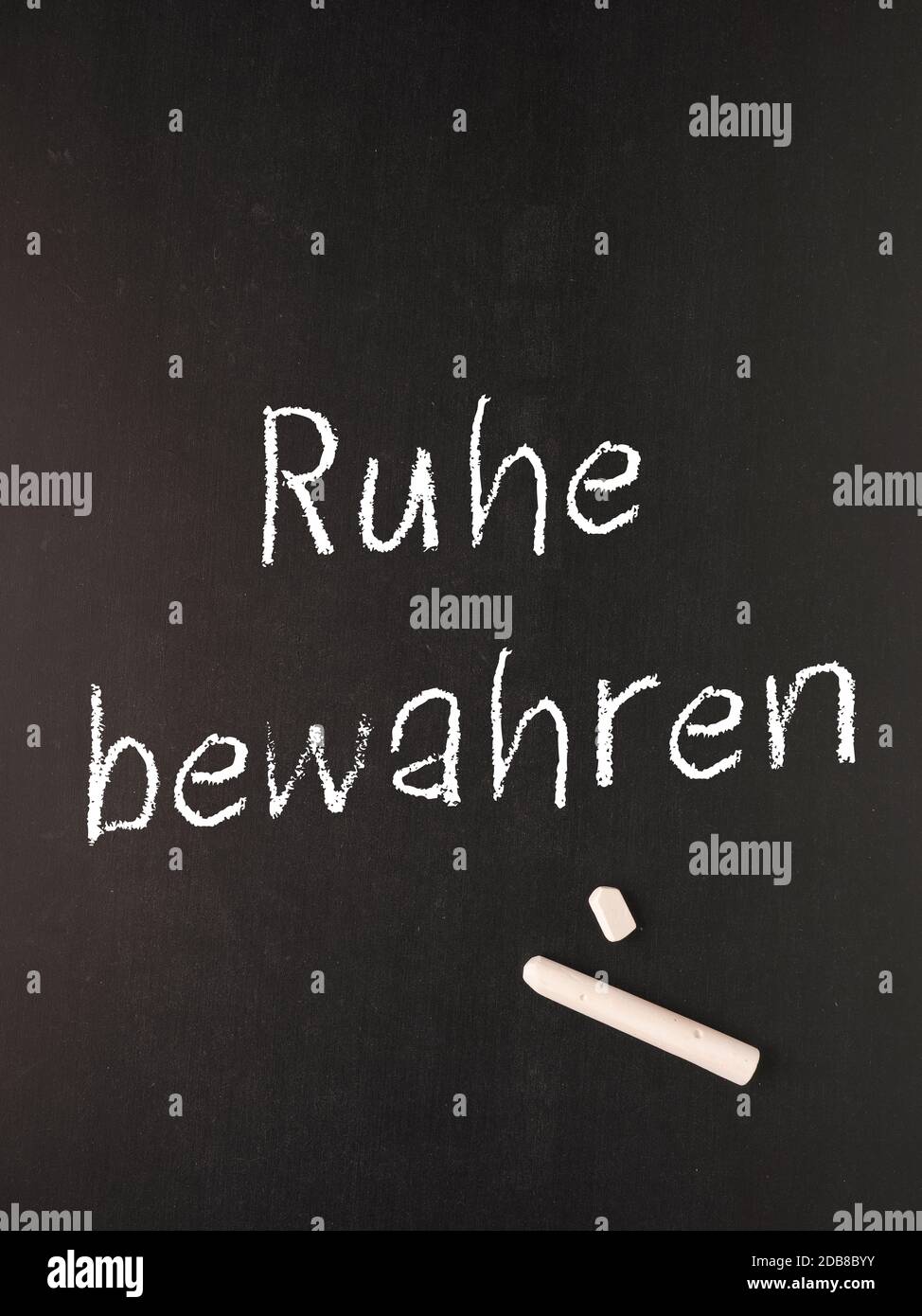 Chalkboard with the German words Keep cool, motivational buisness