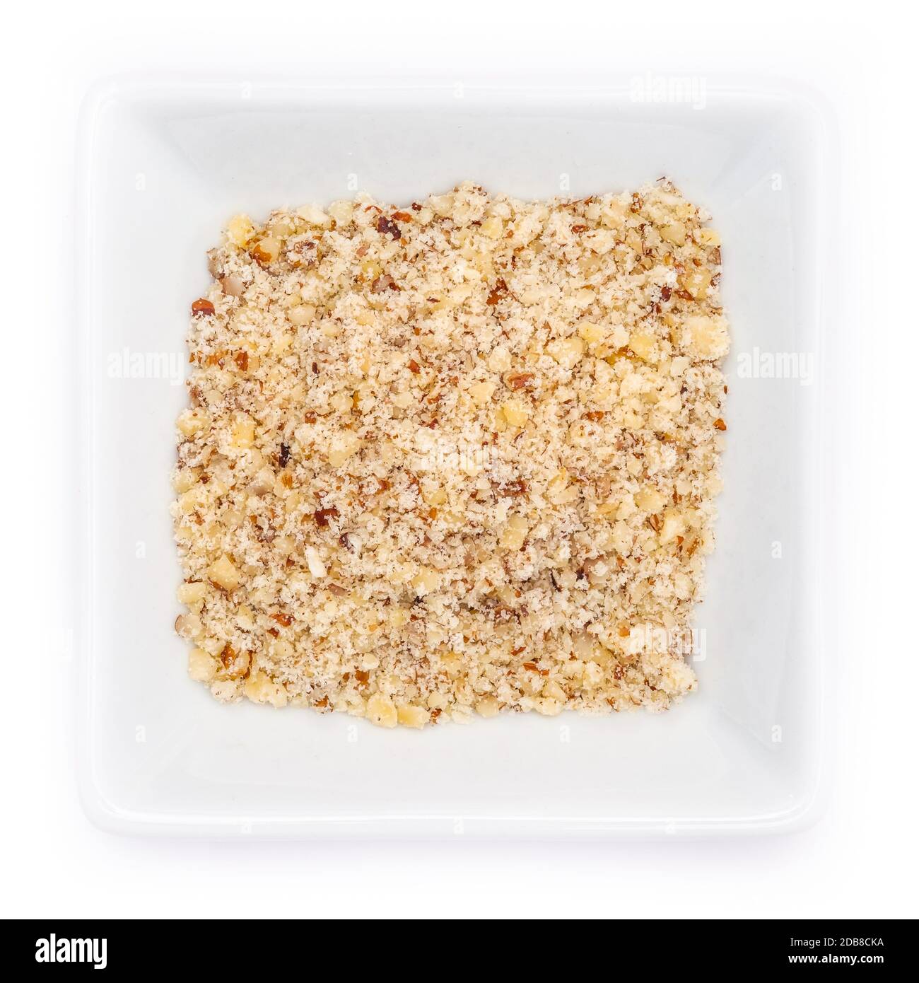 Chopped hazelnuts in a white bowl in top view Stock Photo Alamy