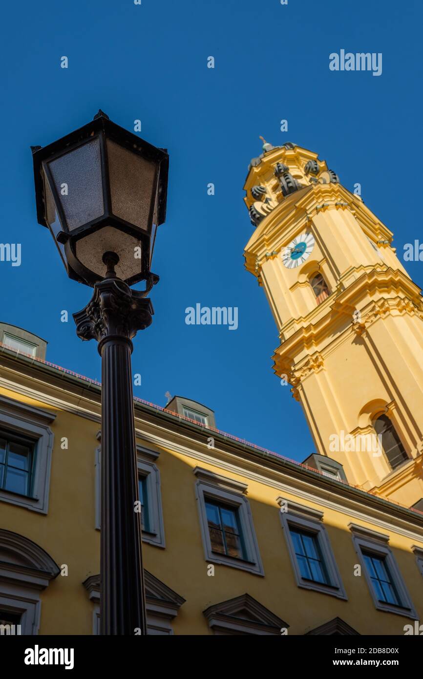 Iron cast street lamp with Theatiner church in munich in vertical format Stock Photo
