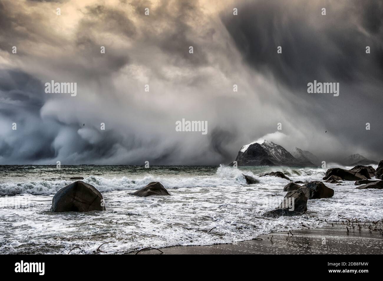 Hail storm approaching beach, Lofoten, Nordland, Norway Stock Photo