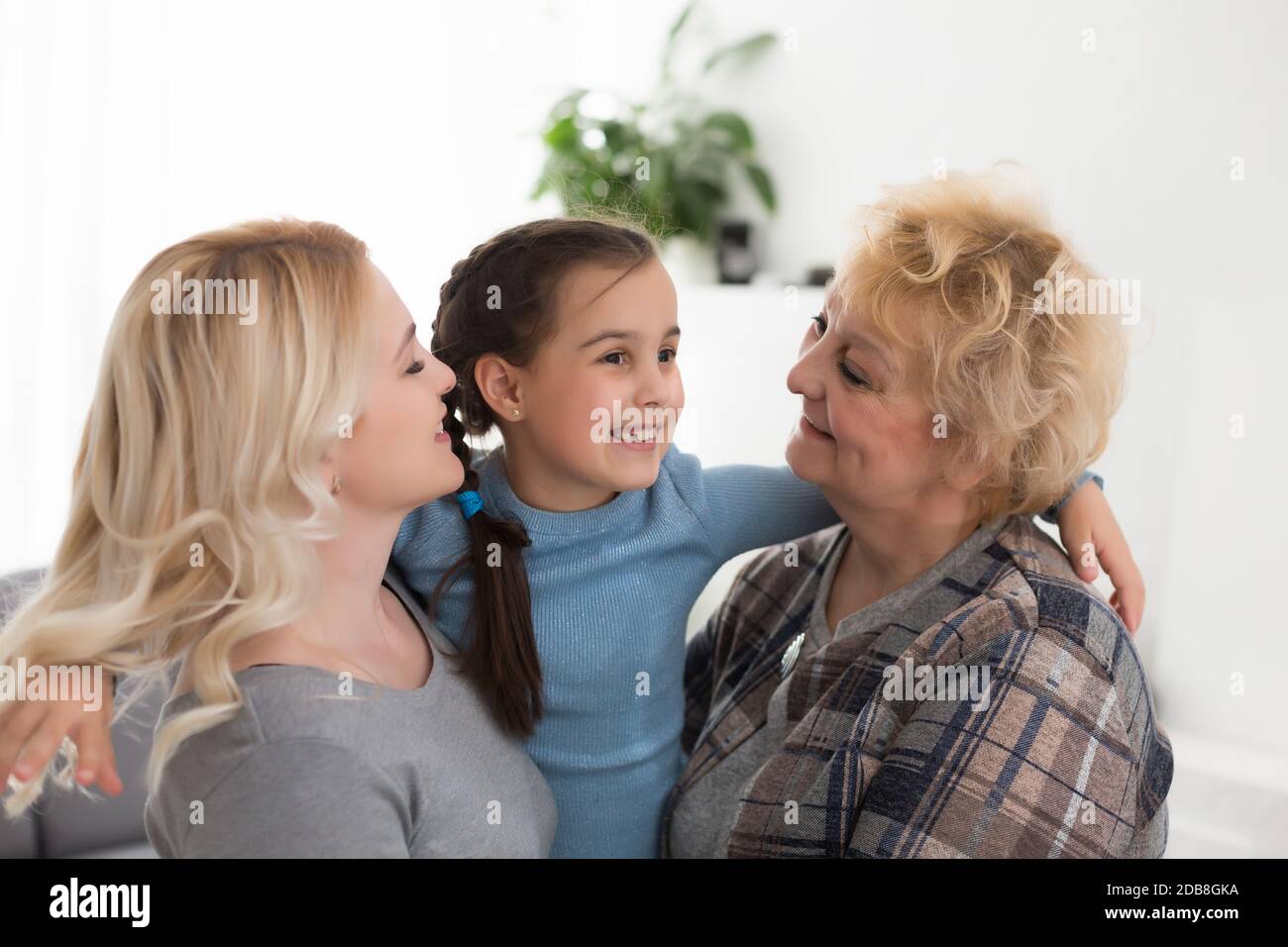 Their granny kissing on the cheek hires stock photography and images